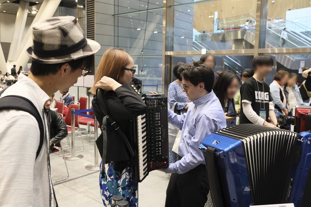 KORG booth, visitors hands-on experience.