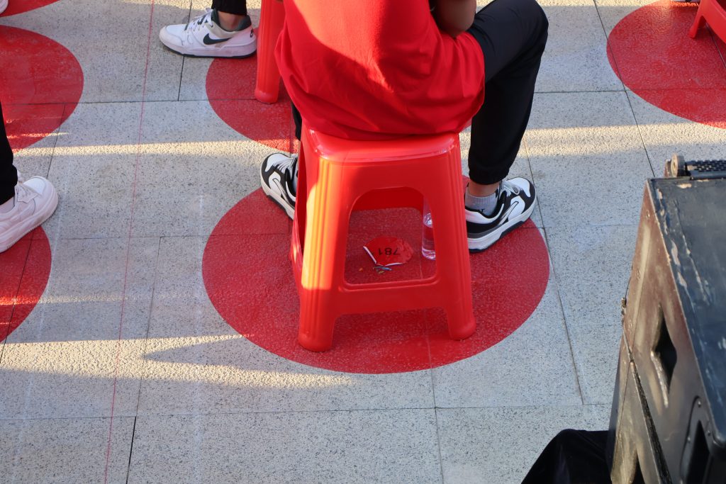 Red circle with number on the ground