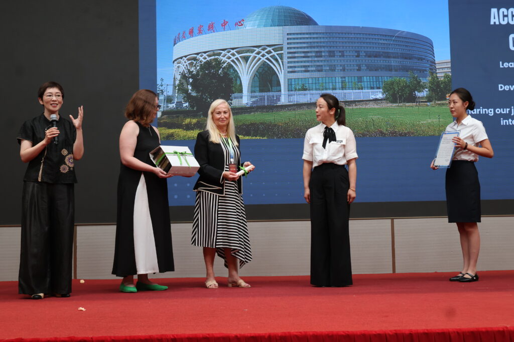 presentation to Tacheng Accordion Museum by Amber and Heather Masefield to Yulan Ma