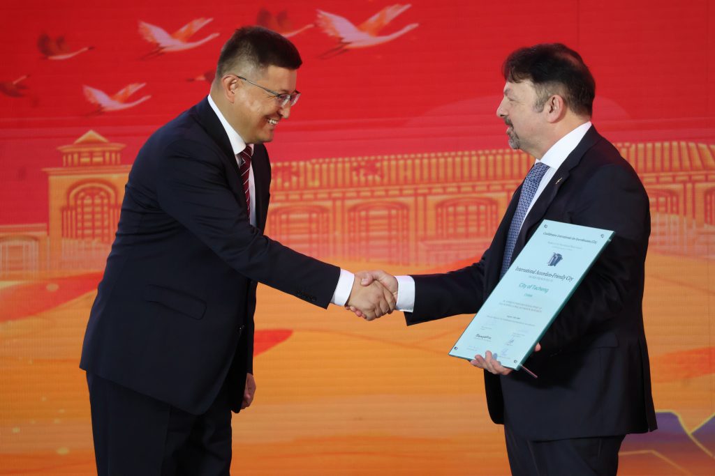 Ye'erbulati Rejiapu Deputy Secretary of Tacheng Municipal Party Committee, Mayor of Tacheng Municipal People's Government and CIA President Mirco Patarini